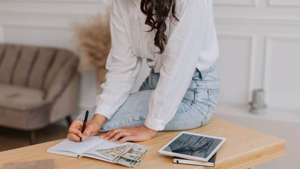 Woman Budgeting Her Cash